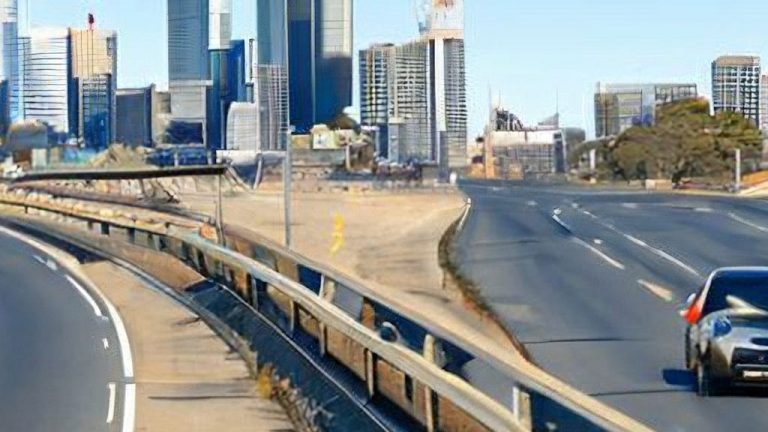 Driving into an artificially generated city that looks a little like Melbourne or Sydney